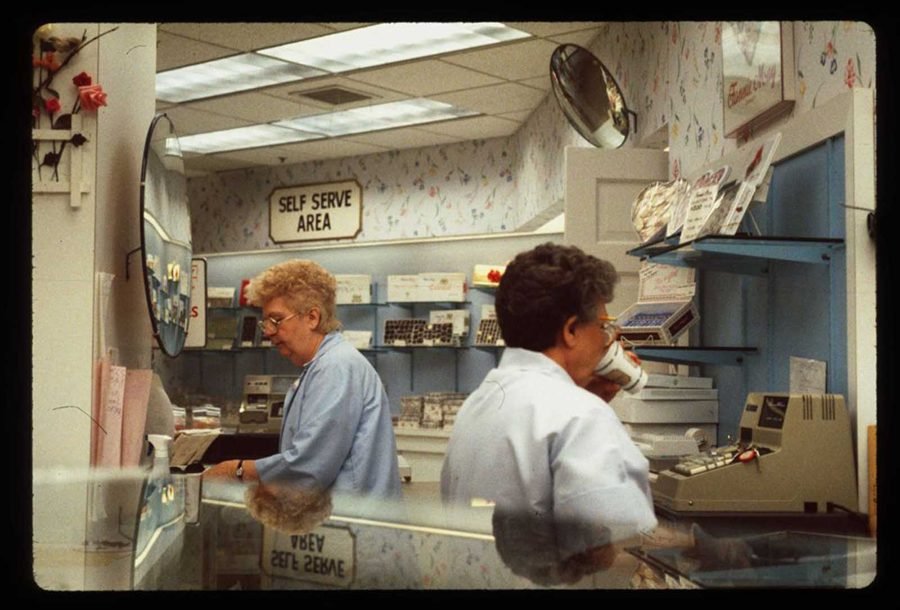 1980s mall Fannie May candy shop with self serve area and clerks behind counter