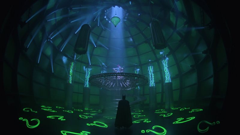 Batman walks into the Riddler's neon-green lair in Batman Forever 1995