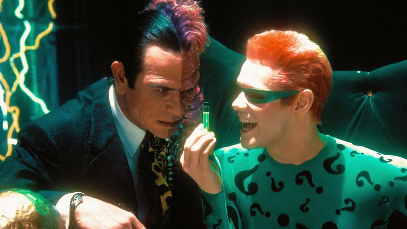 Tommy Lee Jones as Two-Face and Jim Carrey as the Riddler scheming together in Batman Forever 1995