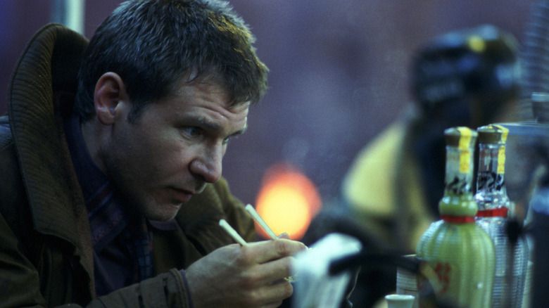 Harrison Ford as Deckard eating at the noodle bar in Blade Runner 1982