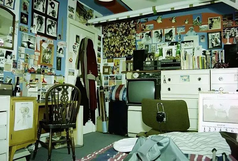 Cluttered 90s teen bedroom magazines and posters