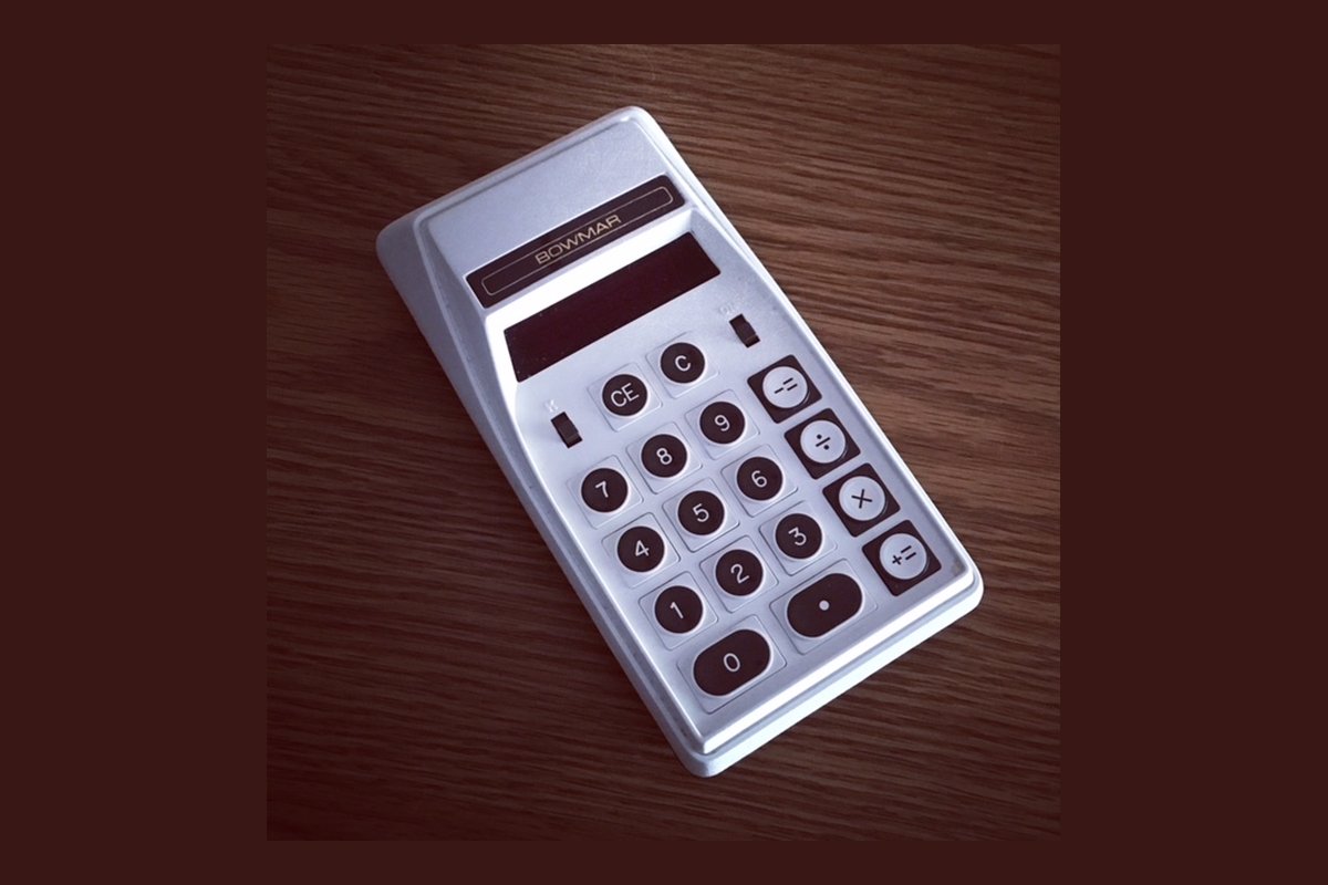 Bowmar 905 four-function pocket calculator with red LED display from the calculator wars era