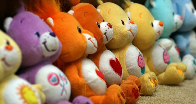 Vintage 1980s Care Bears plush toys by Kenner with belly badge designs