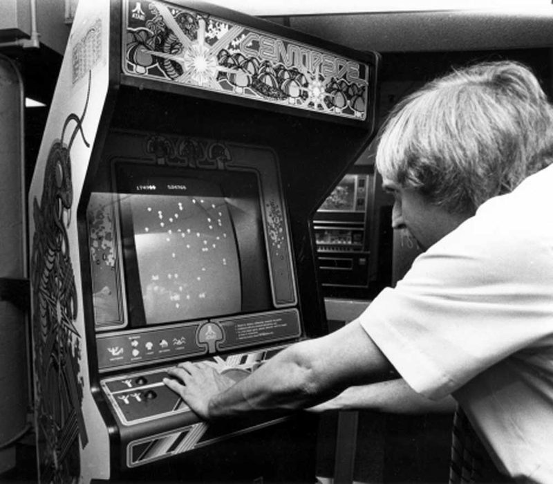 Player at a Centipede 80s arcade machine in Denver, 1982