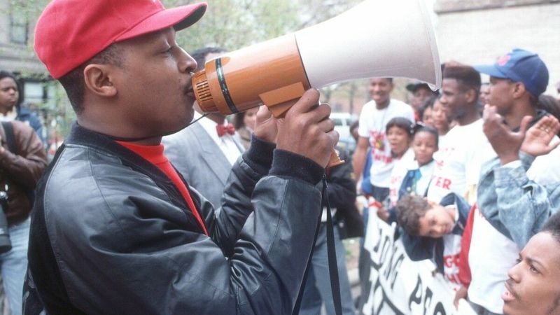 Chuck D of Public Enemy leading Fight the Power rally with megaphone in Bedford-Stuyvesant 1989