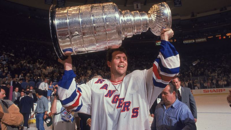 Craig MacTavish celebrates with the Stanley Cup in the Rangers locker room on June 14, 1994