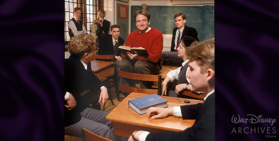 John Keating reading to students with YAWP on the blackboard Dead Poets Society Welton classroom