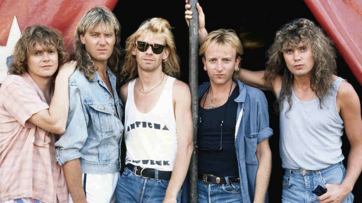Def Leppard band photo from the Hysteria era — Joe Elliott, Phil Collen, Rick Savage, Steve Clark, and Rick Allen, 1987
