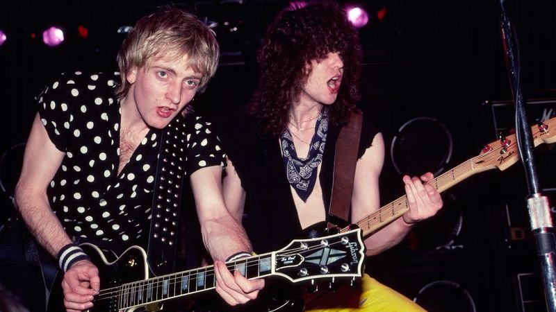 Def Leppard Steve Clark and Rick Savage live on stage