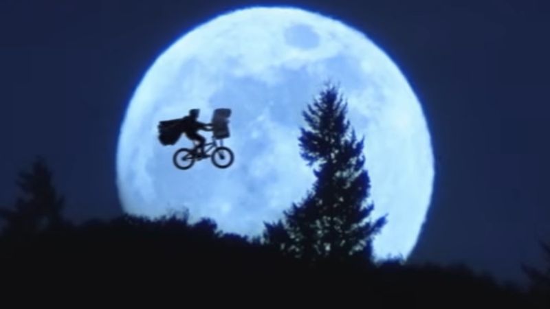 E.T. the Extra-Terrestrial 1982 bicycle silhouette across the full moon