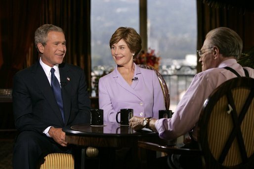 Larry King interview format and suspenders style from Larry King Live debut