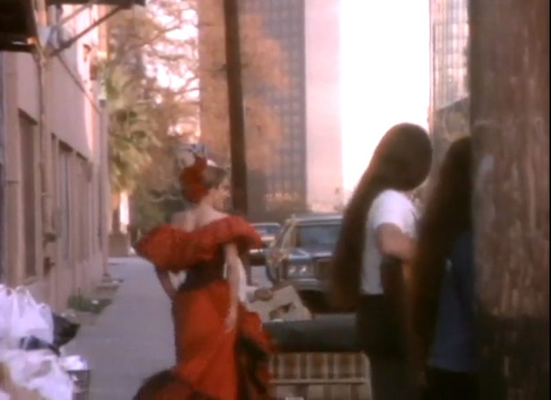 Madonna dancing in a red dress in La Isla Bonita 1987