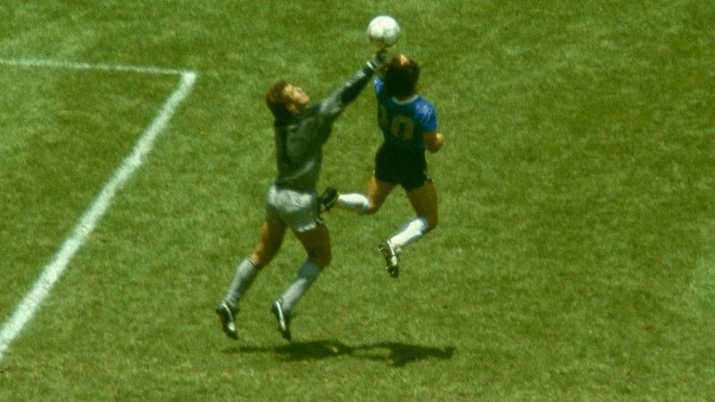 Close-up of Maradona's fist striking the ball before Peter Shilton in 1986
