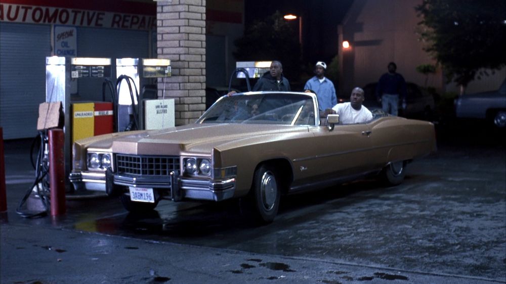 Menace II Society gas station scene with gold Cadillac Eldorado