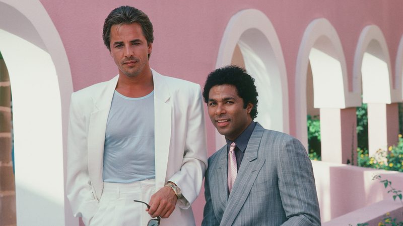 Don Johnson and Philip Michael Thomas in Miami Vice pastel suits defining 80s fashion