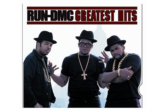 Run-DMC in black fedoras and thick gold chains defining 90s hip-hop fashion
