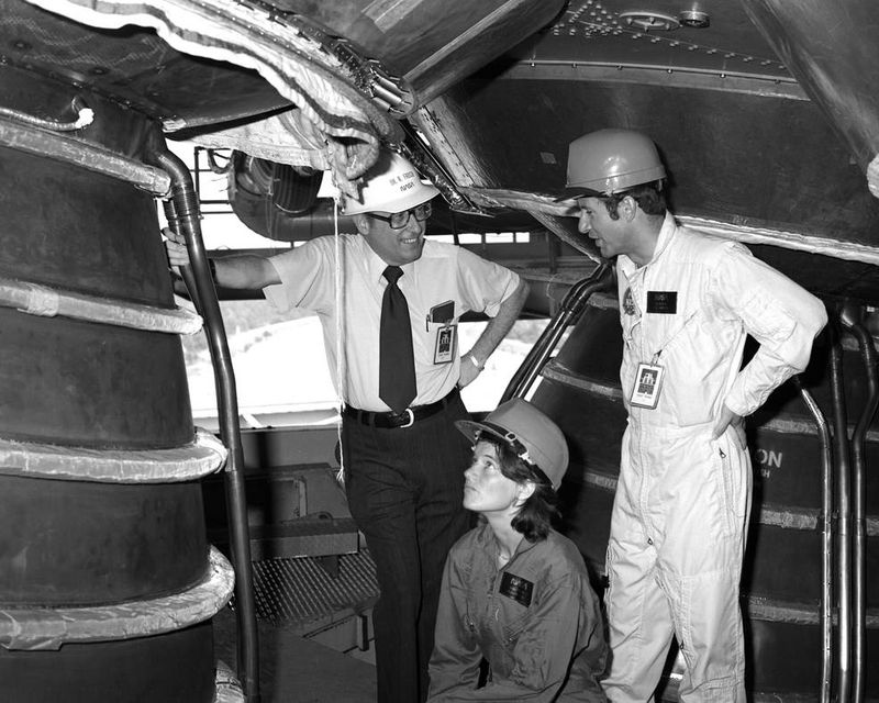 Sally Ride astronaut candidate inspecting space shuttle main engine 1979 NASA