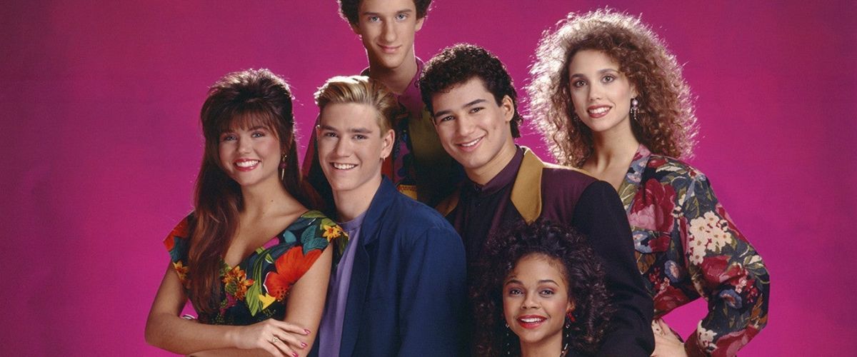 Saved by the Bell cast Bayside High promo portrait on a pink background