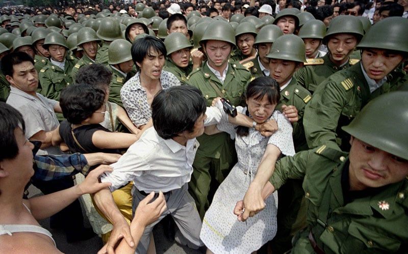 Pro-democracy protesters scuffle with PLA soldiers Beijing 1989 Tiananmen crackdown