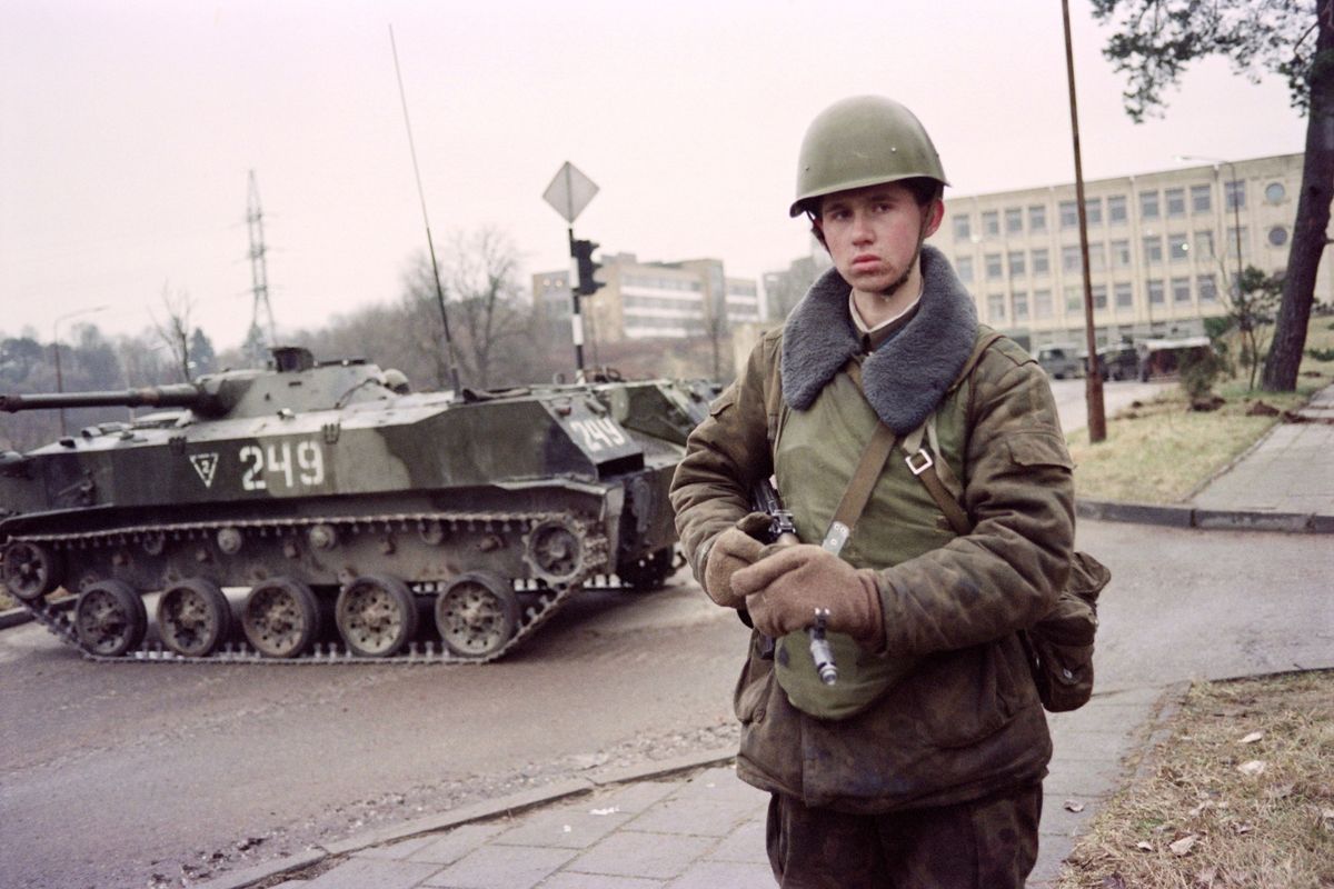 Soviet soldier standing beside a tank in Vilnius during the January 1991 attempt to crush Lithuanian independence