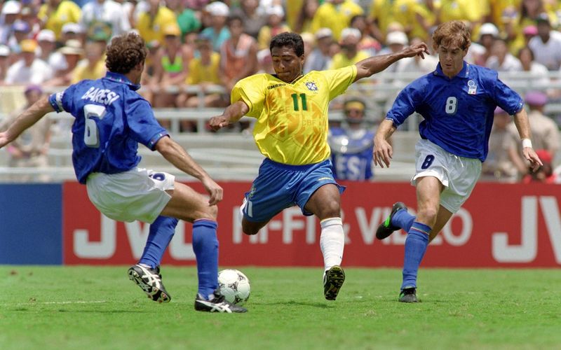 Romario of Brazil dribbling past Italy defenders in the 1994 World Cup final