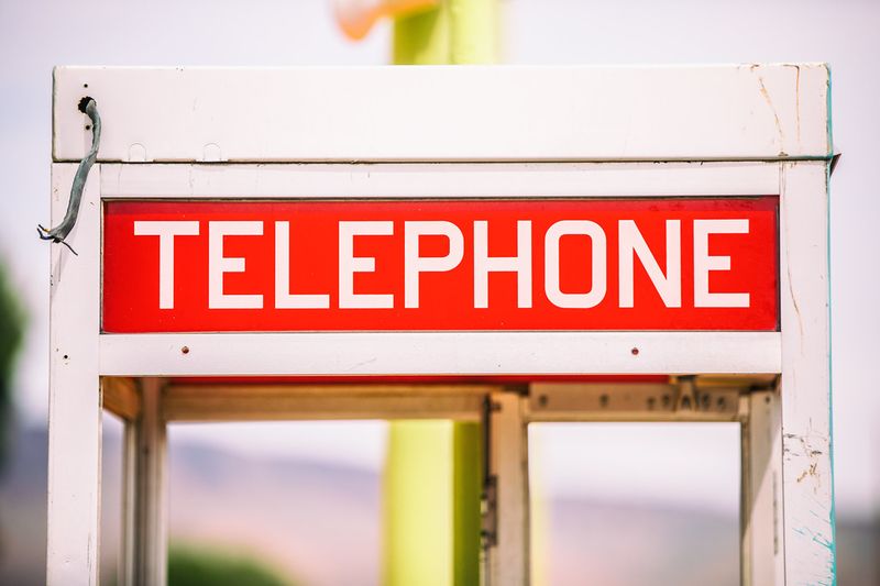 90s telephone booth where you would answer a pager code