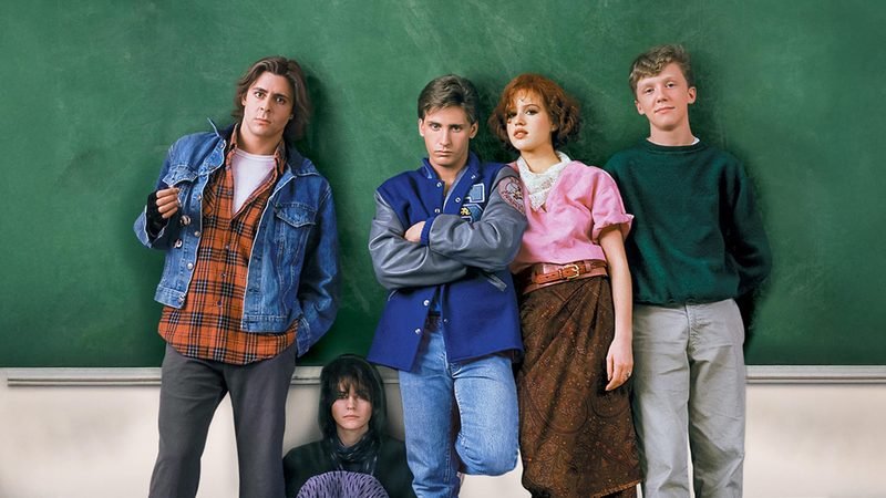 The Breakfast Club five cast members in front of green chalkboard