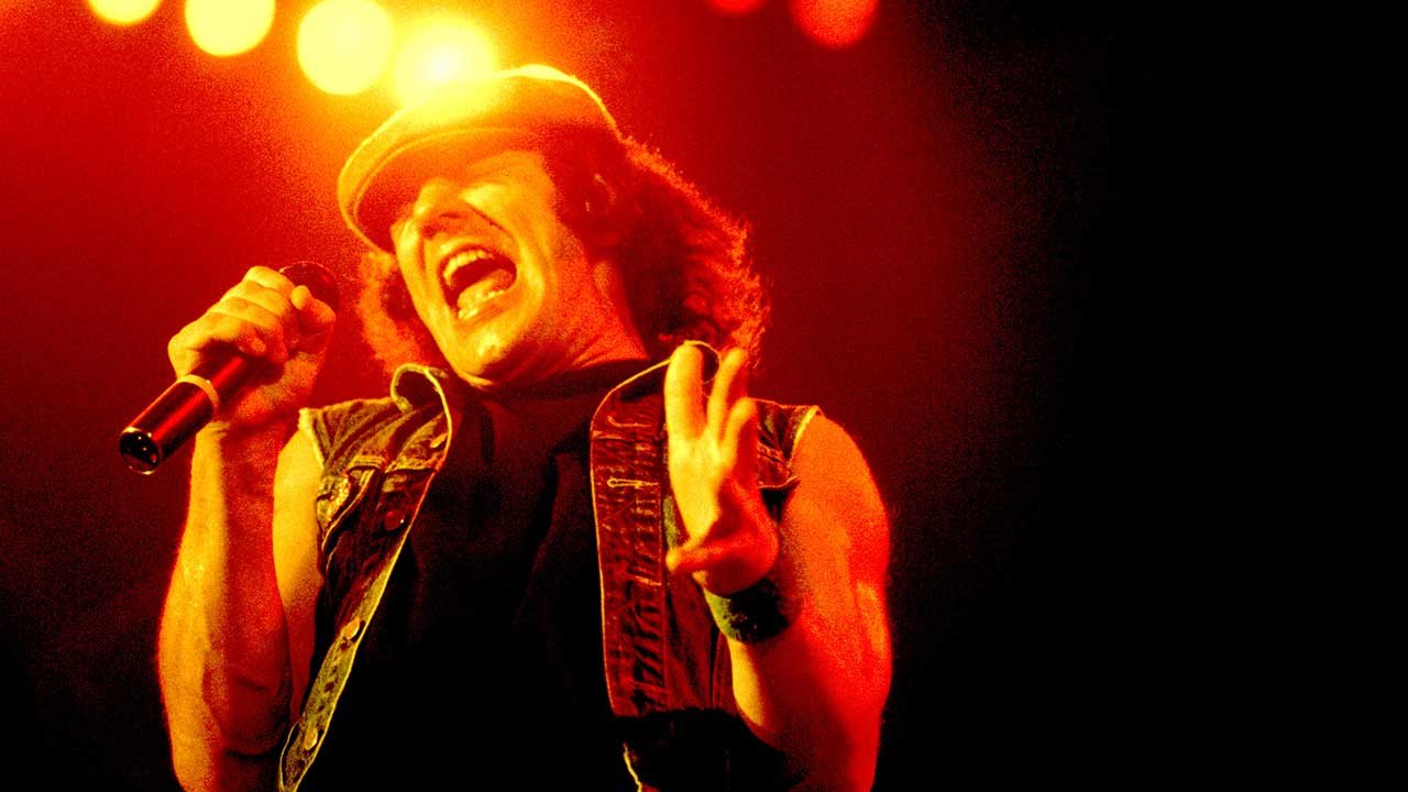 Brian Johnson singing on stage with AC/DC during the Back in Black tour 1980