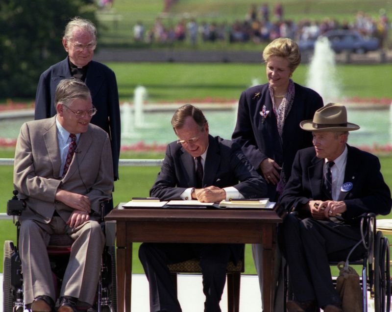 President George H.W. Bush signs the ADA at the White House South Lawn ceremony July 26 1990