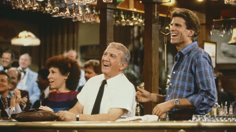 Sam Coach and Carla behind the Cheers bar