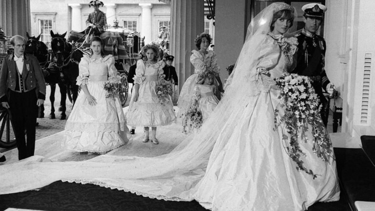 Princess Diana with bridal train and bridesmaids arriving at Buckingham Palace after the 1981 Royal Wedding