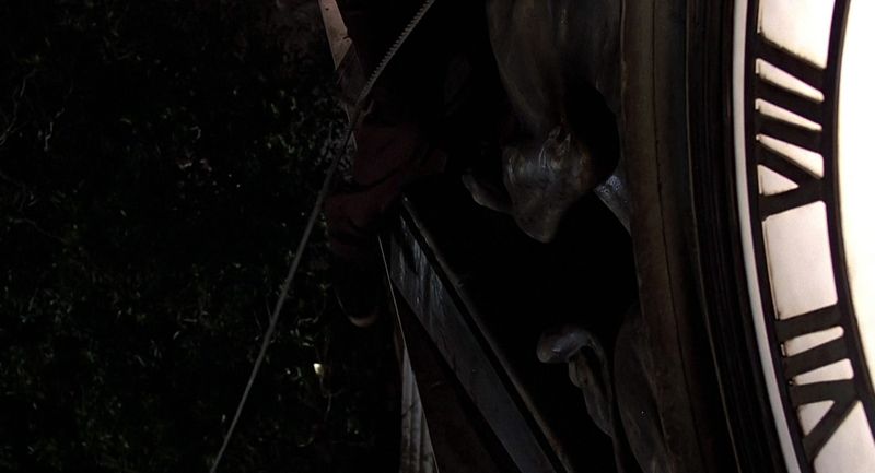Doc Brown hanging from the Hill Valley clock tower in Back to the Future