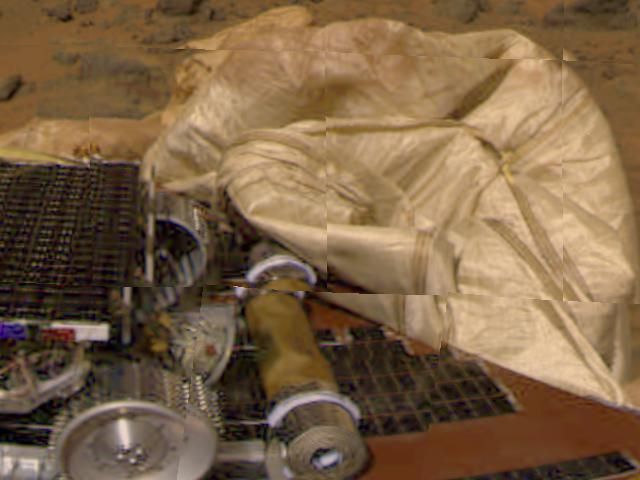 Mars Pathfinder airbags retracted beside the Sojourner rover after the July 4 1997 landing