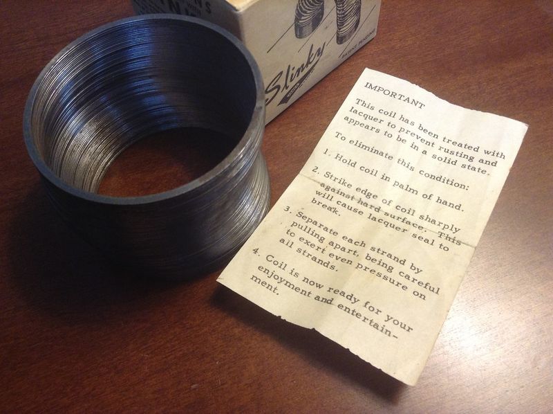 Close-up macro of a compressed metal Slinky coil