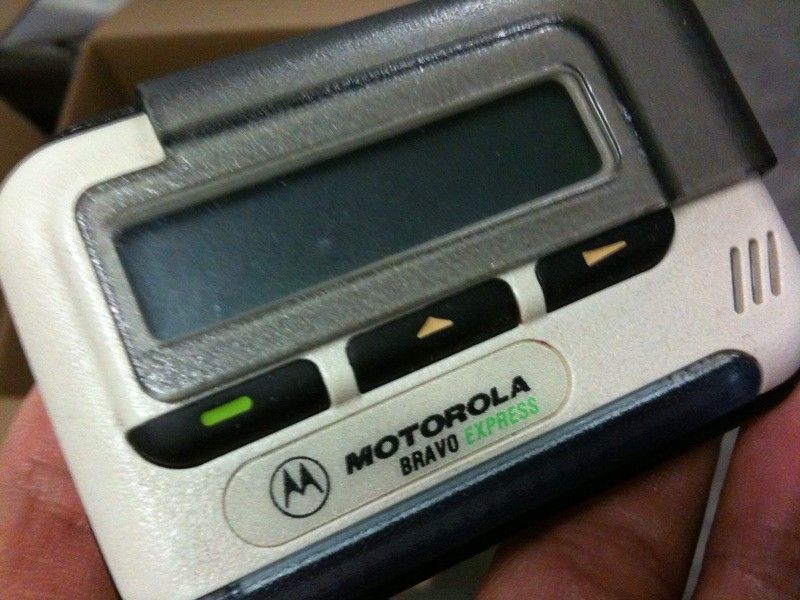 Motorola Bravo Express beeper held in hand