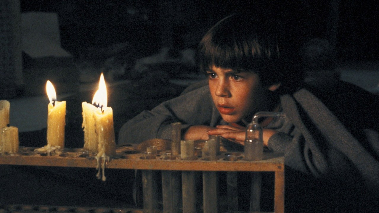 Bastian Balthazar Bux reads the magical book by candlelight in The NeverEnding Story