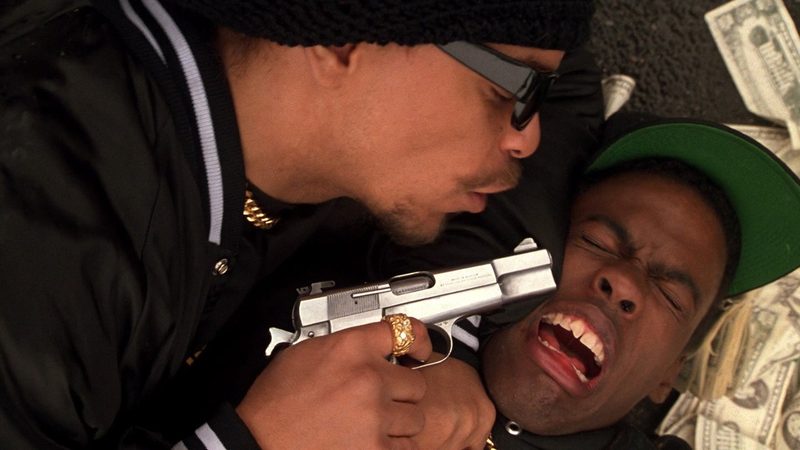 New Jack City undercover cop Scotty played by Ice-T holds a gun on Pookie