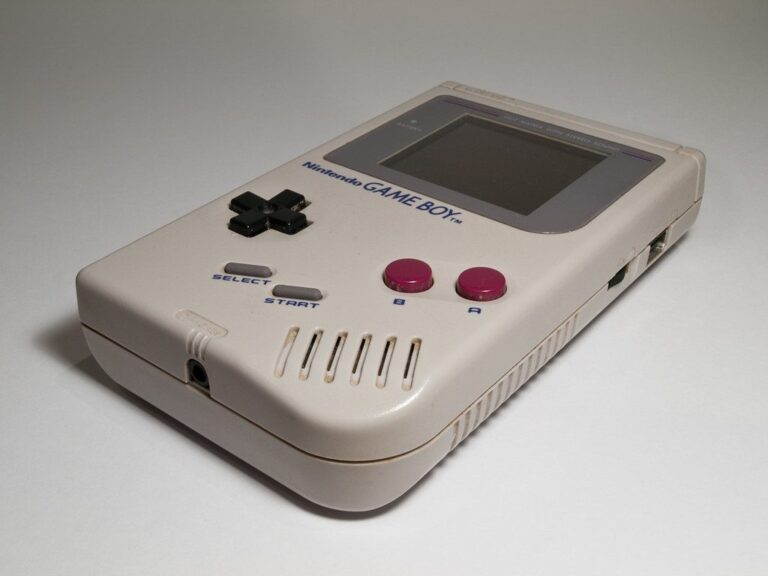 Original grey Nintendo Game Boy DMG-01 handheld console from 1989 with D-pad and magenta A and B buttons
