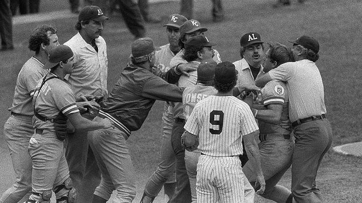 Royals and Yankees players and umpires in the chaotic scrum at home plate during the 1983 Pine Tar Game at Yankee Stadium