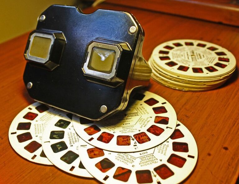 View-Master 3D viewer with stacked reels on a wooden table