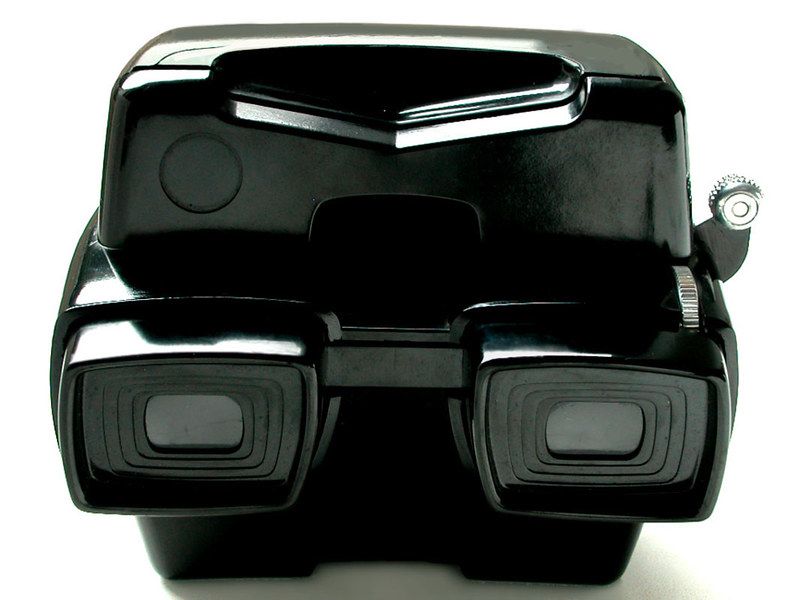 Close-up of a black View-Master viewer eyepieces and focus wheel