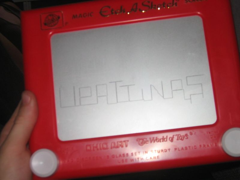 Vintage Etch A Sketch red drawing toy held in hand