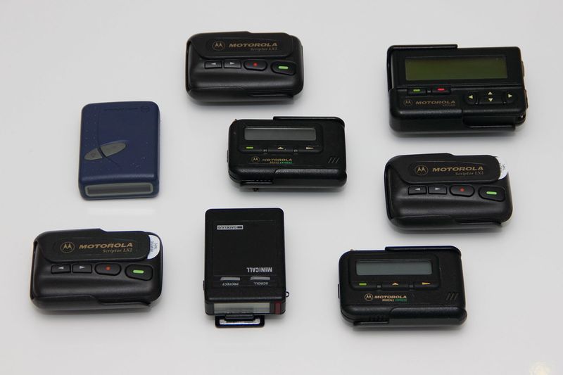 Collection of vintage 90s pagers and beepers