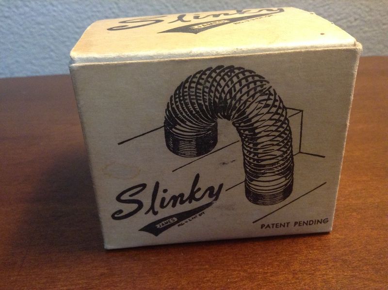Vintage Slinky toy box with Patent Pending James Industries branding