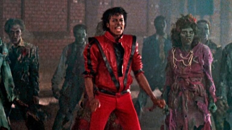 Michael Jackson in the iconic red leather jacket leading the zombie horde in Thriller (1983)