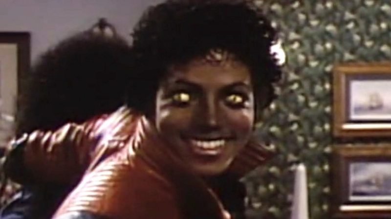 Michael Jackson with glowing yellow eyes in the werecat transformation scene from Thriller