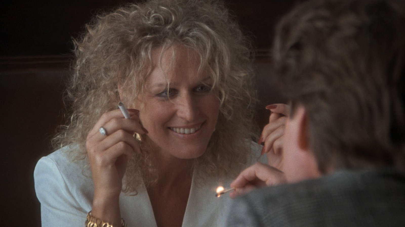 Glenn Close as Alex Forrest lighting a cigarette in Fatal Attraction 1987