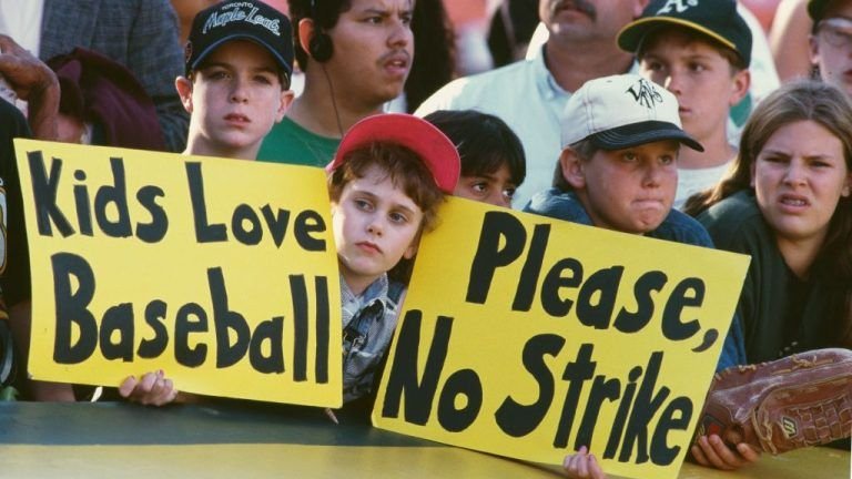 Young baseball fans hold protest signs at Oakland Coliseum against the 1994 MLB players strike