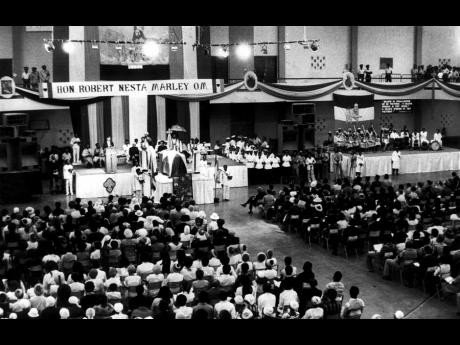 Mourners gather for Bob Marley's funeral service at the National Arena, Kingston, May 1981