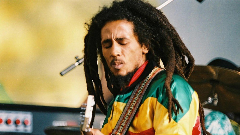 Bob Marley performing on stage in his later touring years